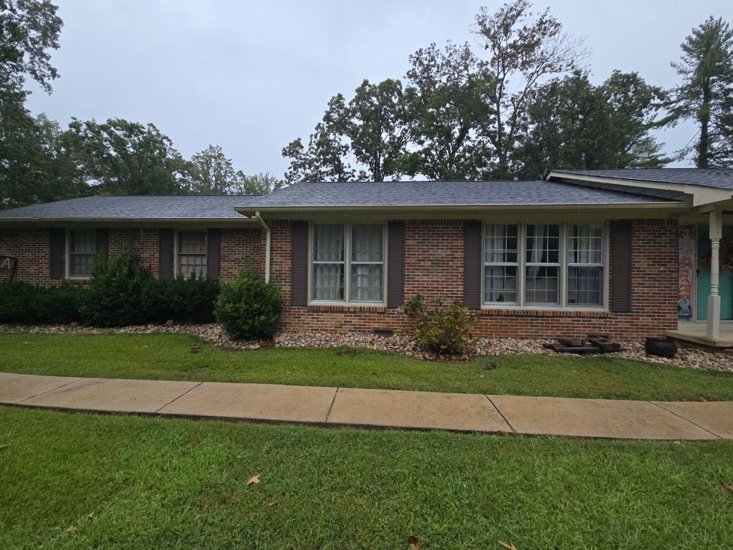Brick ranch home with a finished roof